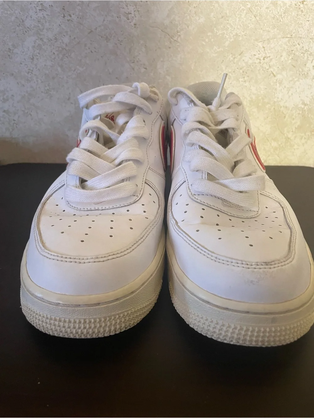Nike Air Force 1 All-White Low Top Sneakers with Red Swoosh